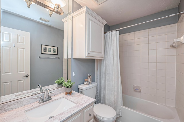 full bathroom featuring shower / bath combo, visible vents, vanity, and toilet