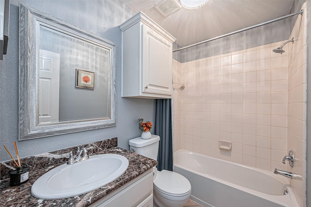 full bath featuring a textured wall, toilet, vanity, visible vents, and shower / bathtub combination with curtain