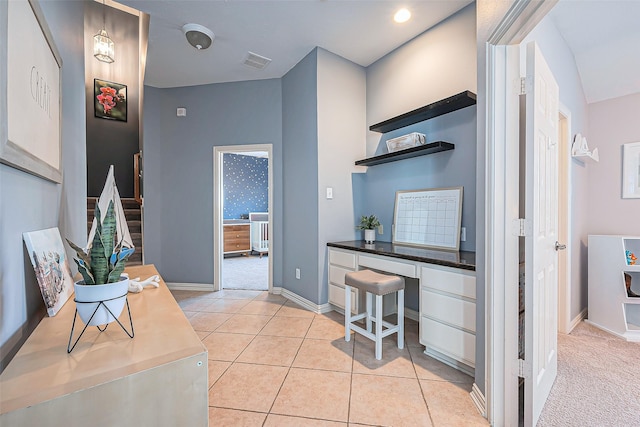 interior space with visible vents, baseboards, and light tile patterned floors