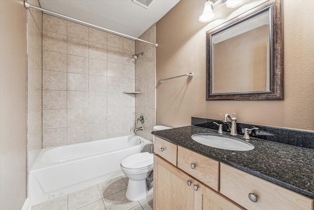 full bath featuring a textured wall, toilet, vanity,  shower combination, and tile patterned flooring