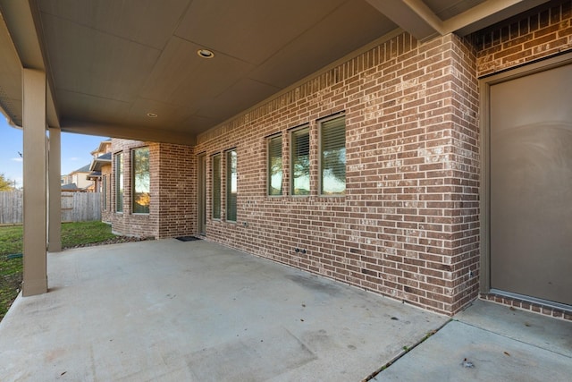 view of patio featuring fence