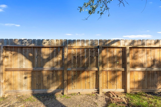 view of gate featuring fence