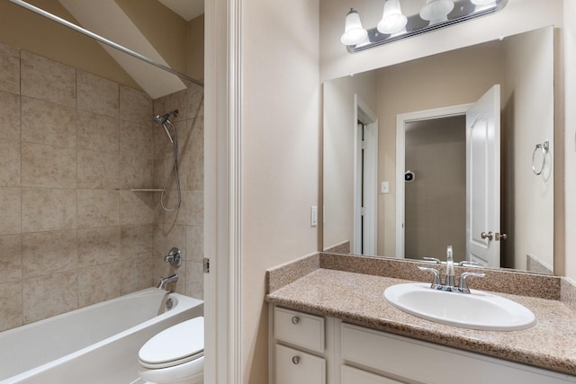 full bath with shower / tub combination, vanity, and toilet