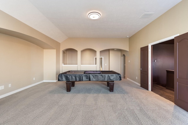 playroom featuring lofted ceiling, baseboards, arched walkways, and carpet flooring