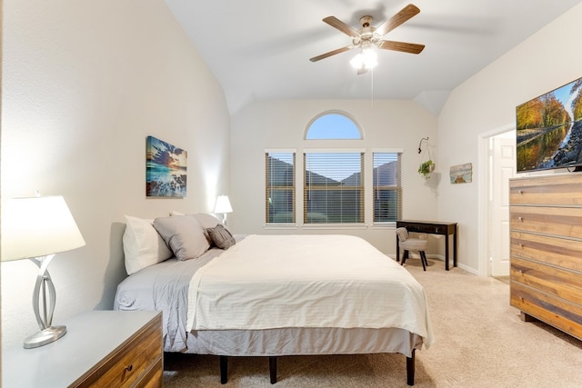 bedroom with baseboards, light carpet, a ceiling fan, and vaulted ceiling