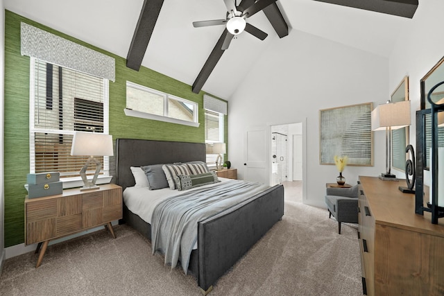 carpeted bedroom with high vaulted ceiling, beamed ceiling, and ceiling fan