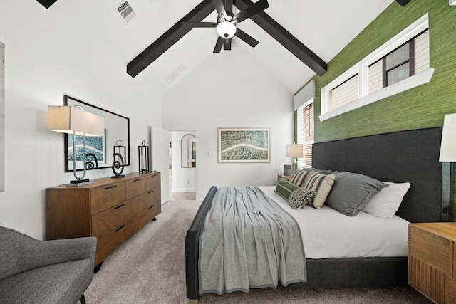 bedroom featuring ceiling fan, high vaulted ceiling, visible vents, and light colored carpet