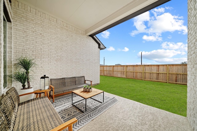 view of patio / terrace with fence and an outdoor hangout area