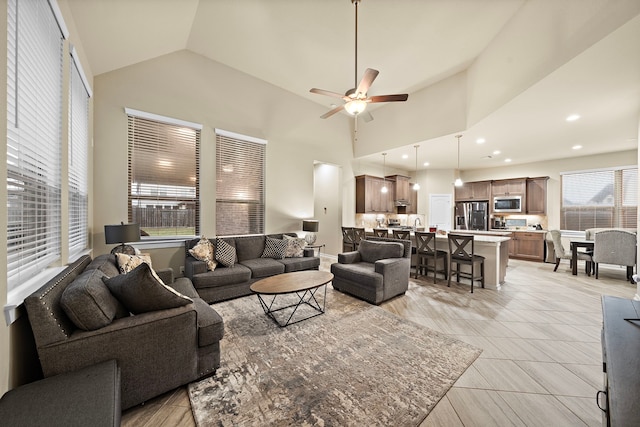 living room featuring light tile patterned flooring, recessed lighting, high vaulted ceiling, and ceiling fan