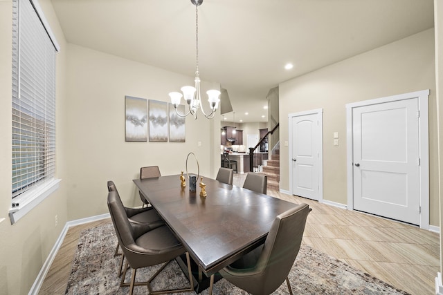 dining space featuring stairs, a notable chandelier, recessed lighting, and baseboards