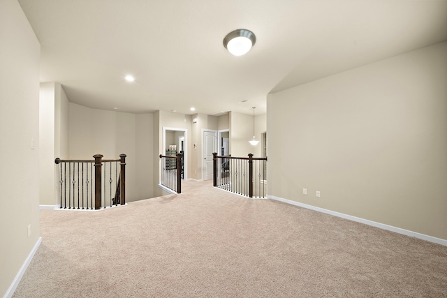 carpeted empty room with recessed lighting and baseboards