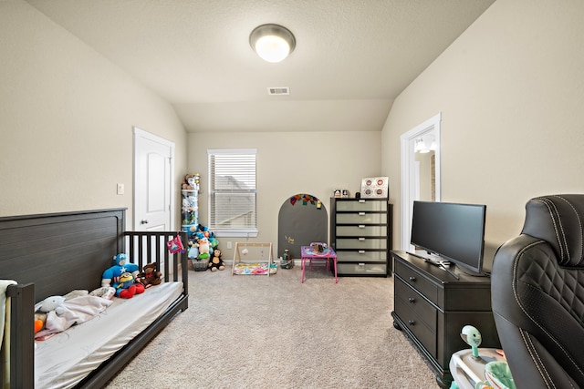 carpeted bedroom with lofted ceiling and visible vents