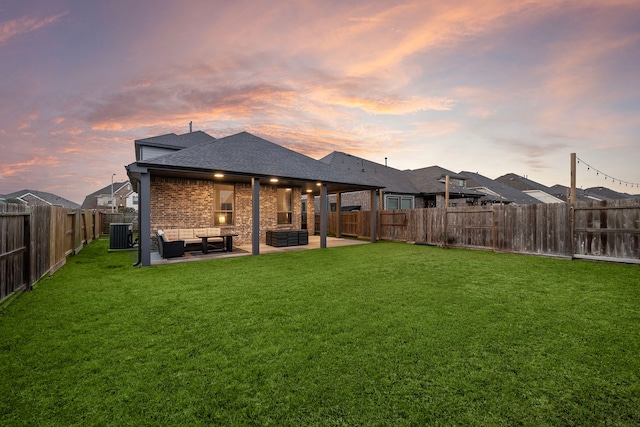 rear view of property with an outdoor living space, a yard, a patio, and a fenced backyard