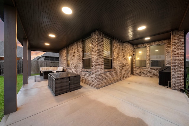 view of patio featuring an outdoor hangout area and fence