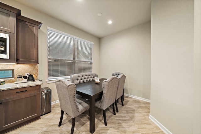 dining area with recessed lighting and baseboards