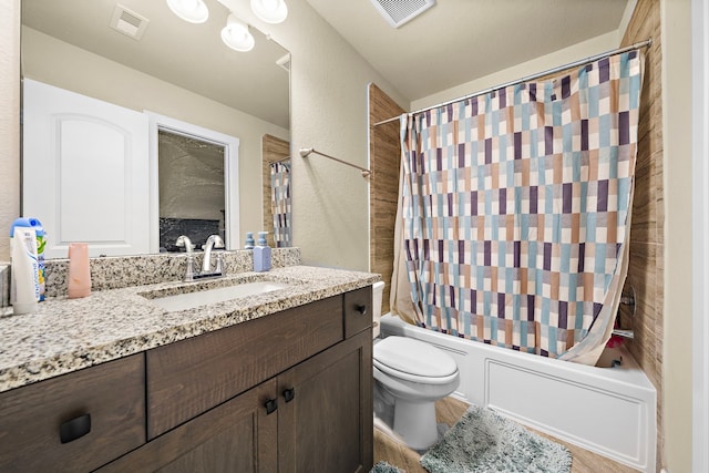 bathroom with vanity, toilet, visible vents, and shower / tub combo with curtain