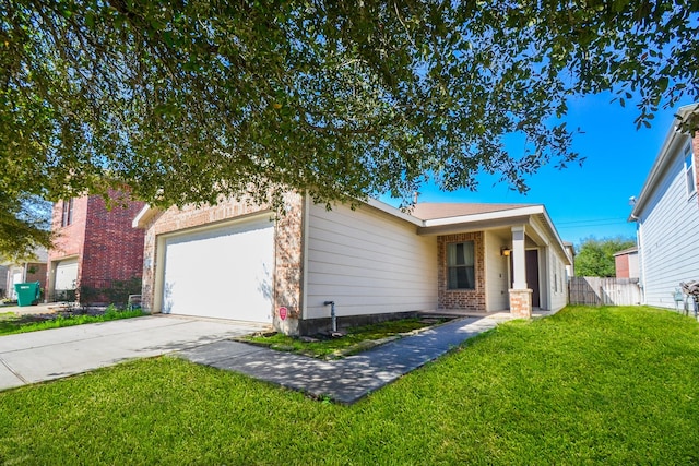 view of front facade with a garage, concrete driveway, brick siding, and a front yard