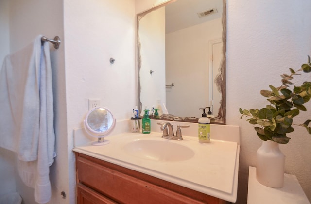 bathroom featuring visible vents and vanity