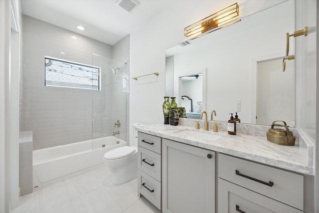 bathroom featuring toilet, washtub / shower combination, visible vents, and vanity