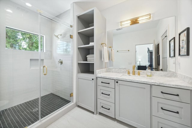 bathroom with a stall shower and vanity