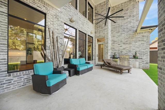 view of patio featuring a grill and an outdoor hangout area