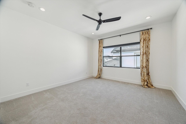 carpeted empty room featuring recessed lighting, a ceiling fan, and baseboards