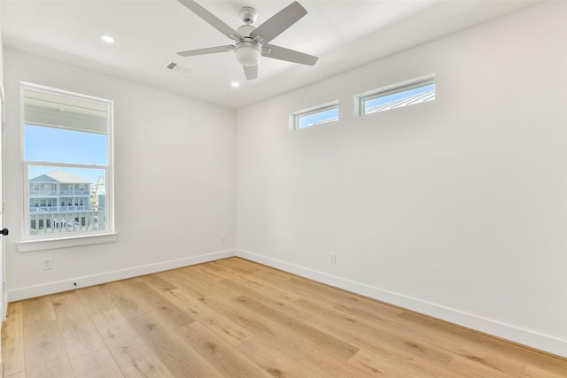 unfurnished room featuring light wood finished floors, recessed lighting, visible vents, a ceiling fan, and baseboards