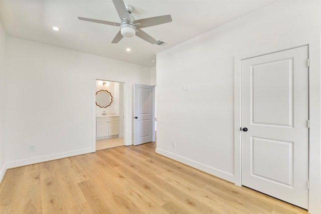 unfurnished bedroom with recessed lighting, ensuite bathroom, ceiling fan, light wood-type flooring, and baseboards