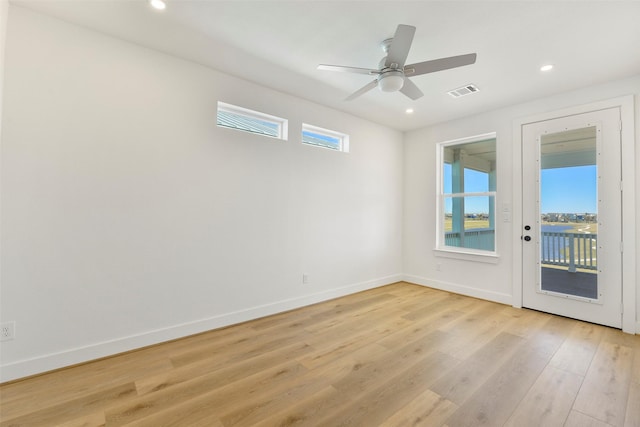 spare room with ceiling fan, recessed lighting, visible vents, baseboards, and light wood-style floors