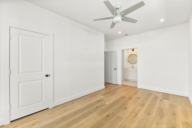 unfurnished bedroom featuring recessed lighting, visible vents, connected bathroom, light wood-type flooring, and baseboards