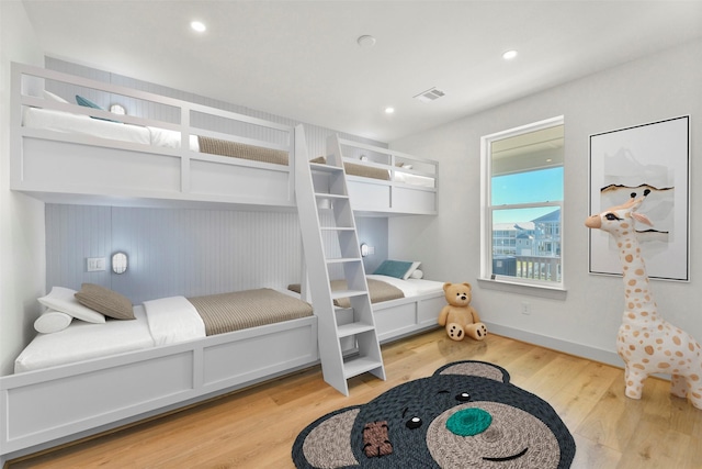 bedroom with recessed lighting, visible vents, light wood-style flooring, and baseboards