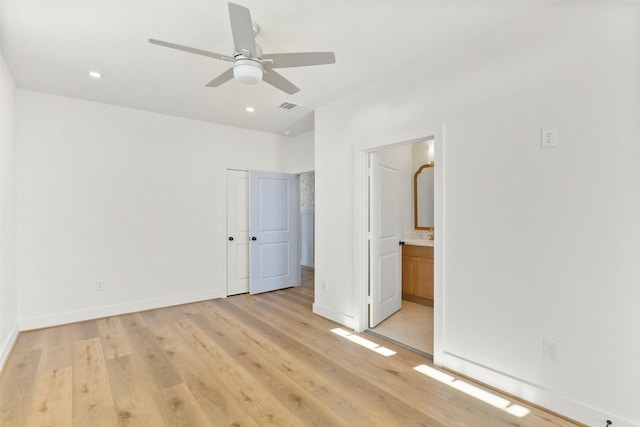 unfurnished bedroom featuring recessed lighting, visible vents, connected bathroom, light wood-type flooring, and baseboards