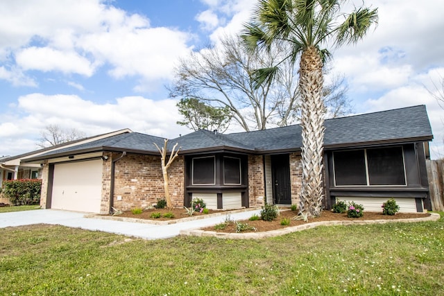 single story home with a front yard, a garage, brick siding, driveway, and roof with shingles