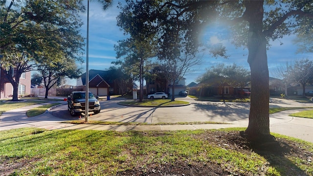 view of road featuring a residential view, curbs, and sidewalks