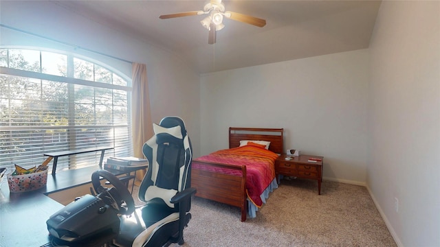 bedroom featuring baseboards, a ceiling fan, lofted ceiling, and carpet flooring