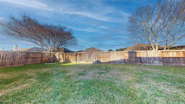 view of yard featuring a fenced backyard