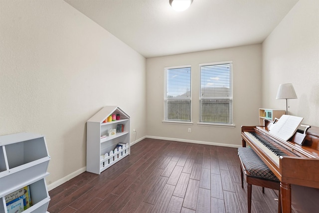 living area with dark wood finished floors and baseboards