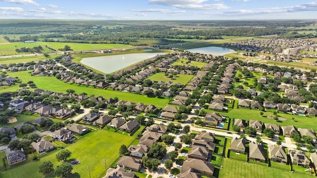 birds eye view of property featuring a water view and a residential view