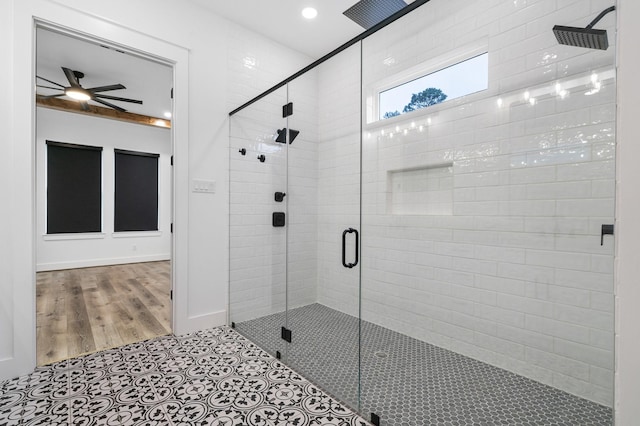 full bathroom with recessed lighting, a ceiling fan, a shower stall, tile patterned flooring, and baseboards