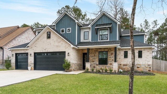 view of front of house with concrete driveway, fence, board and batten siding, and a front yard