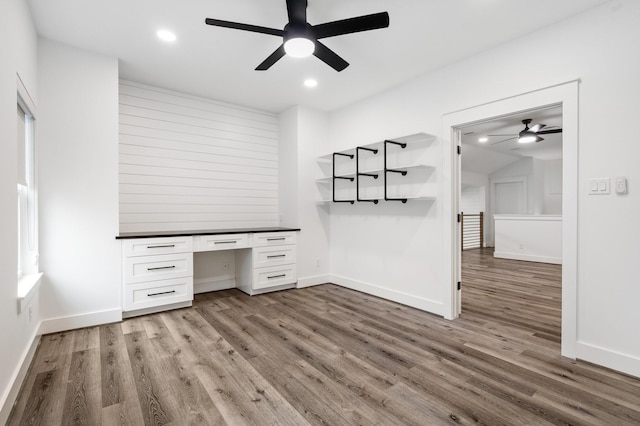 245 E Blue Heron Dr, Montgomery, TX 77316 - unfurnished office with a ceiling fan, built in study area, wood finished floors, and recessed lighting