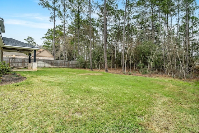 view of yard with fence