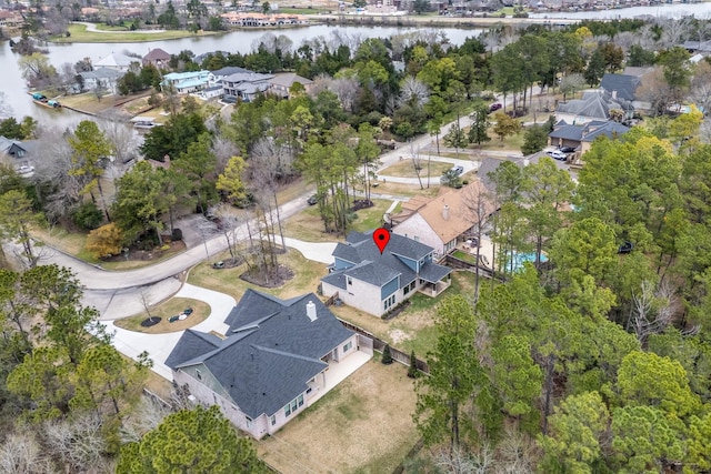 bird's eye view with a residential view and a water view