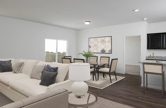 living room featuring dark wood-style floors, recessed lighting, and baseboards