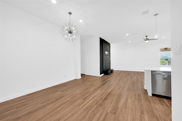 unfurnished living room featuring recessed lighting, visible vents, light wood-style flooring, and baseboards