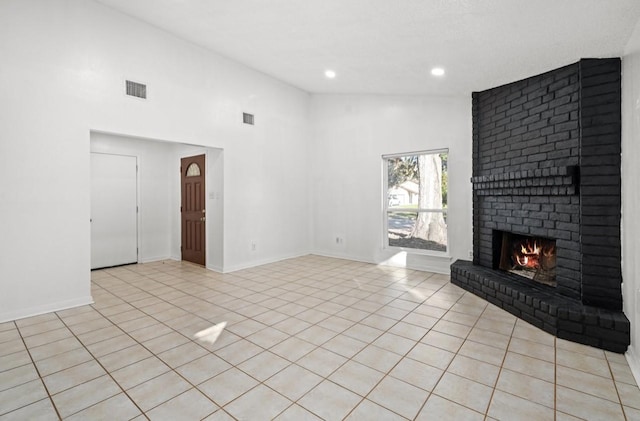 unfurnished living room with light tile patterned floors, baseboards, visible vents, a fireplace, and recessed lighting