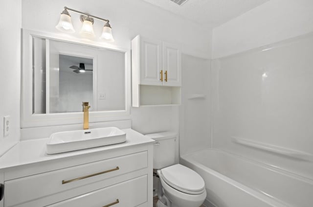 full bathroom featuring toilet, shower / bathing tub combination, and vanity