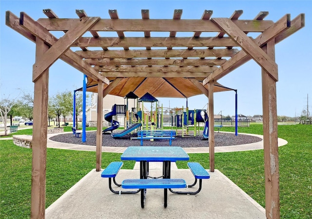 community jungle gym with a lawn and a pergola