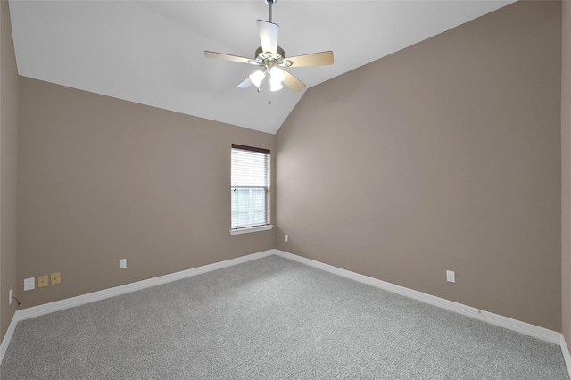 carpeted spare room with baseboards, lofted ceiling, and ceiling fan