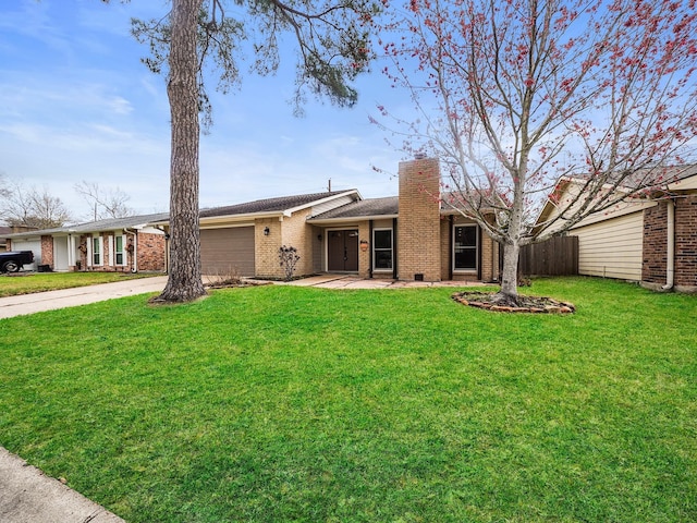 single story home with driveway, a chimney, an attached garage, fence, and brick siding